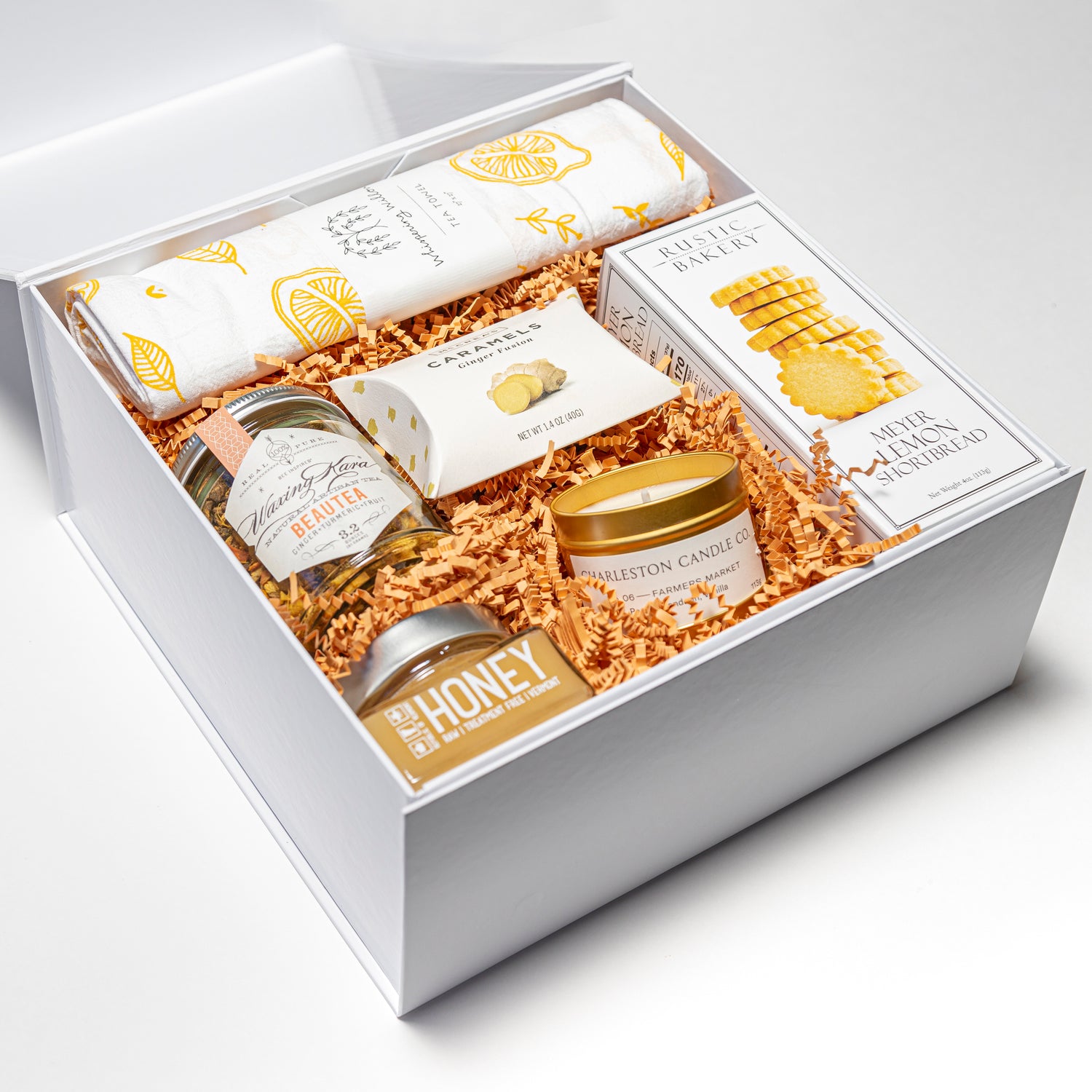 Gift box, with cookie, tea, honey, caramels, tea towel and scented candle. 